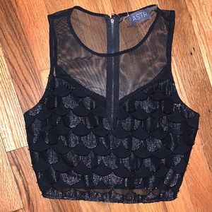 ASTR Cropped Mesh Top with a Hint of Sparkle in the Scallop Design
Small Xsmall
